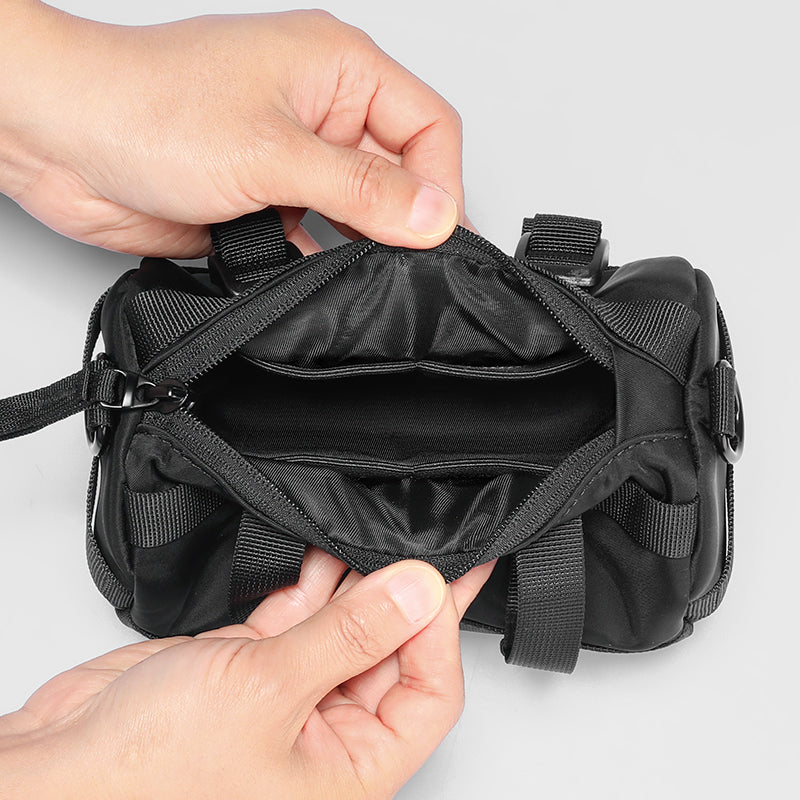 Mark Ryden Global black cylinder crossbody bag with multiple compartments