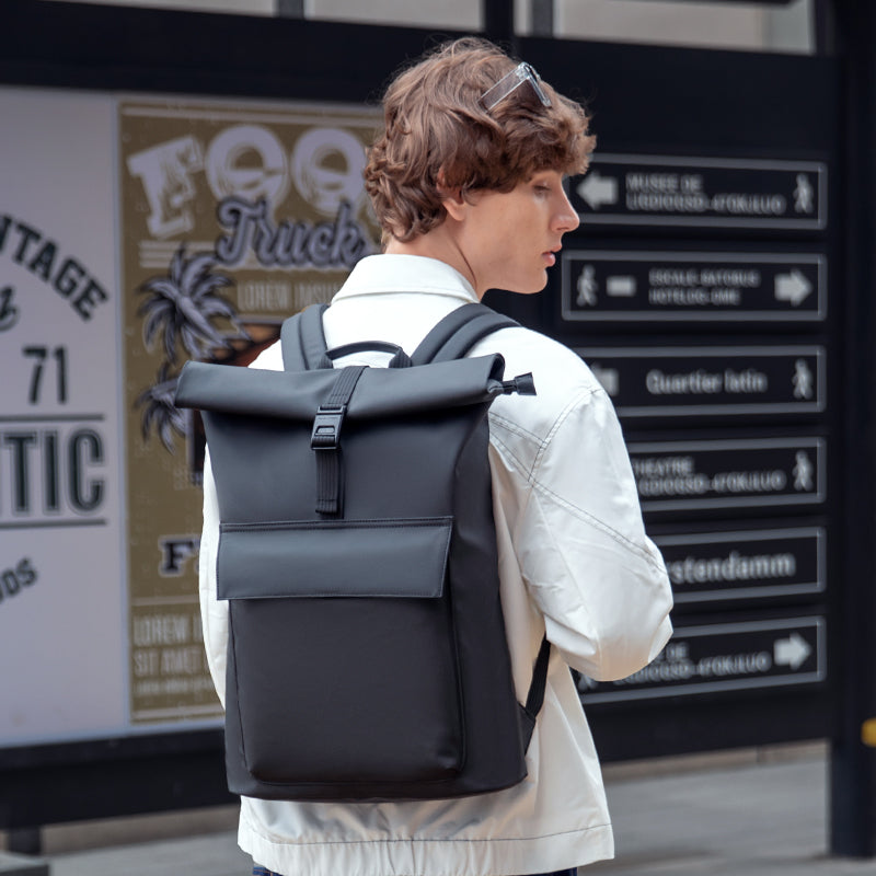 Black roll-top minimalist backpack for daily commute | Mark Ryden Global