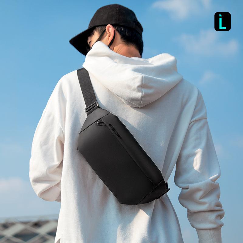 Mark Ryden Global: Casual I Water-Repellent Double-Layer Shoulder Bag on man in white hoodie, outdoor