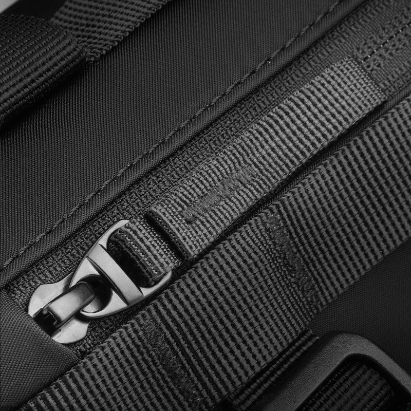 MarkRyden Global's MotoBarrel cylinder crossbody bag - black strap with metal buckle detail