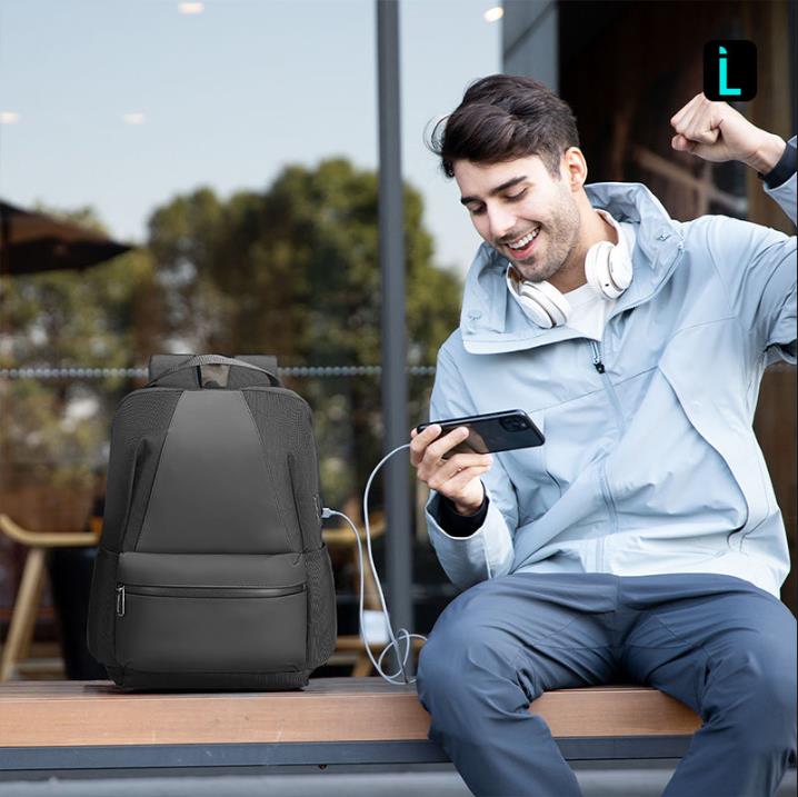 Softologic I water-repellent backpack with modern traveler using phone at Mark Ryden Global