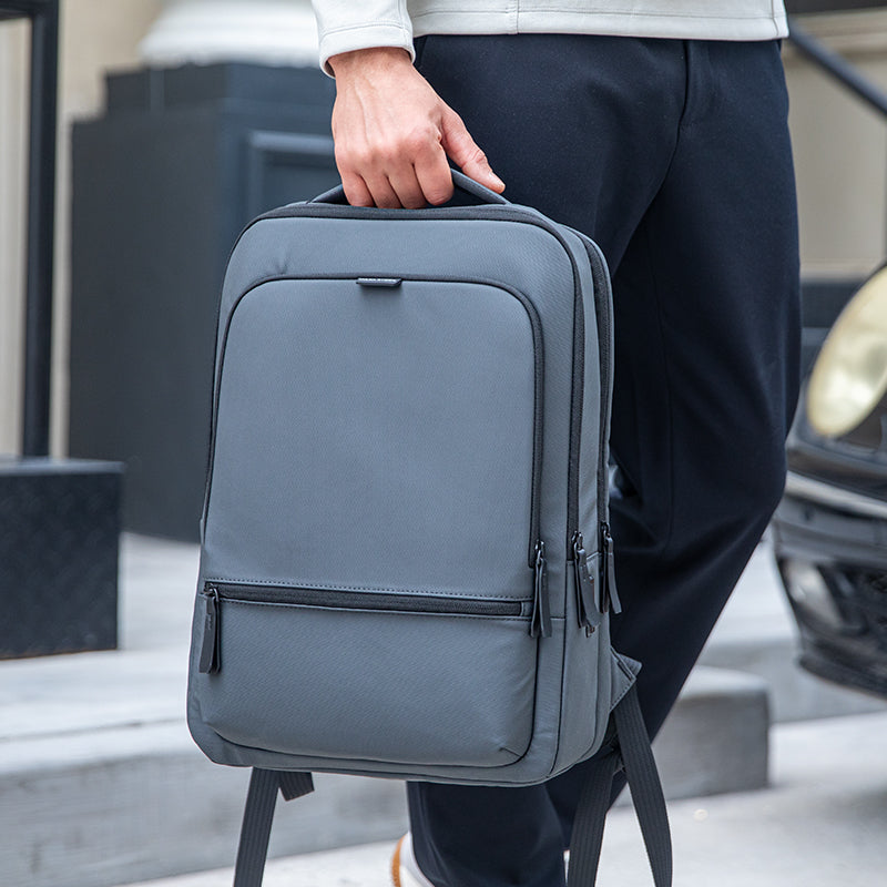 Gray ChargeFlex smart backpack with multiple zippers, power your day - MarkRyden Global