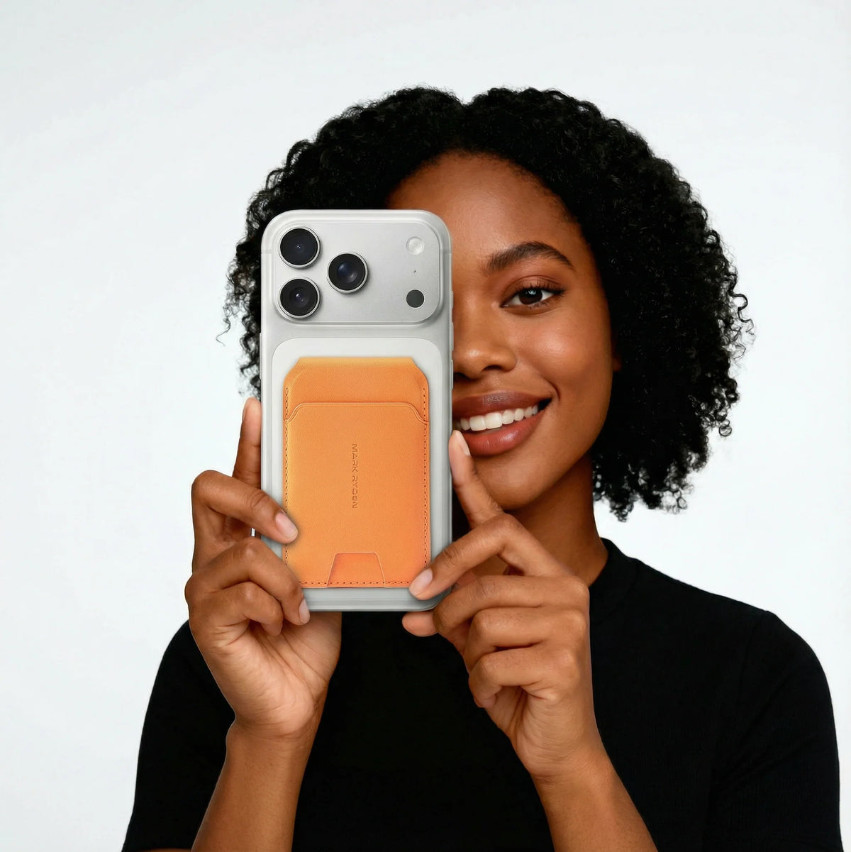 Mark Ryden Global slim orange MagSafe card holder wallet on smartphone