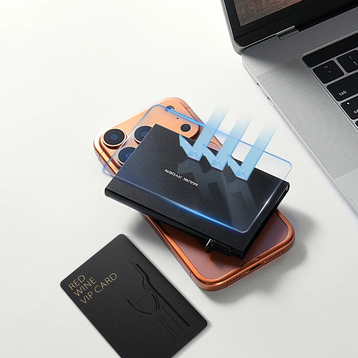 Black ultra-thin metal card holder by Mark Ryden, protecting a VIP card on a rose gold smartphone with blue protection arrows.