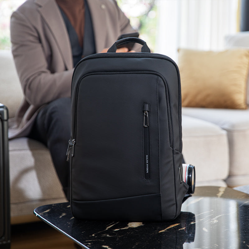 Sleek black Mark Ryden UrbanLite Pro water-resistant business travel backpack on table