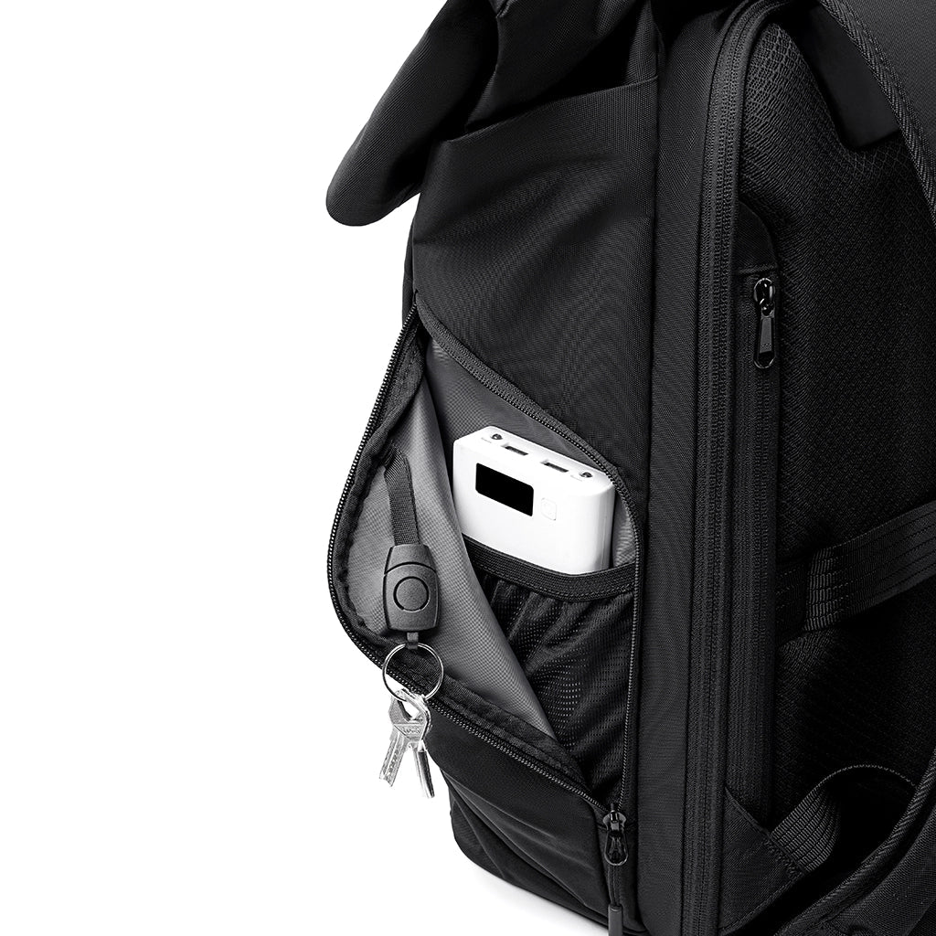 Black Mark Ryden MorphCore backpack with zippered pocket containing power bank and keys