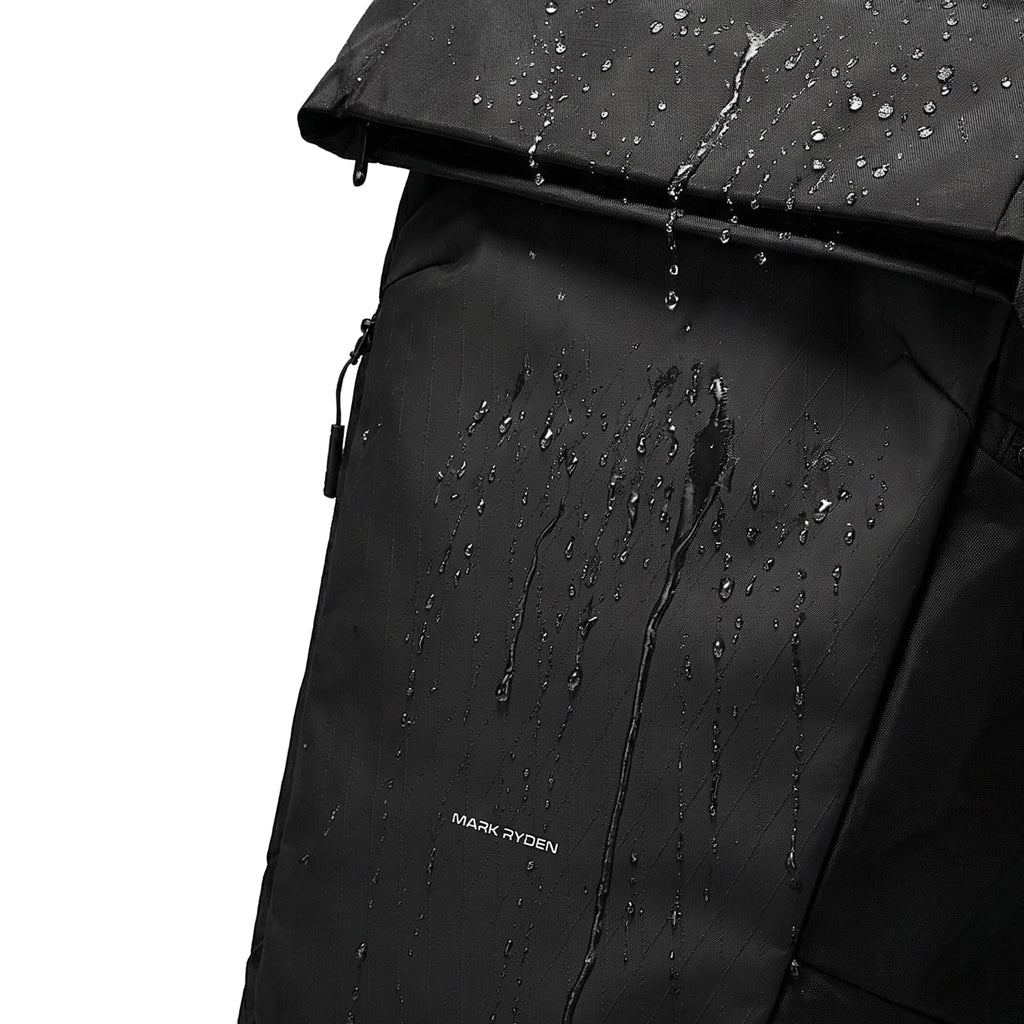 Mark Ryden MorphCore backpack with water droplets showcasing waterproof design for travelers