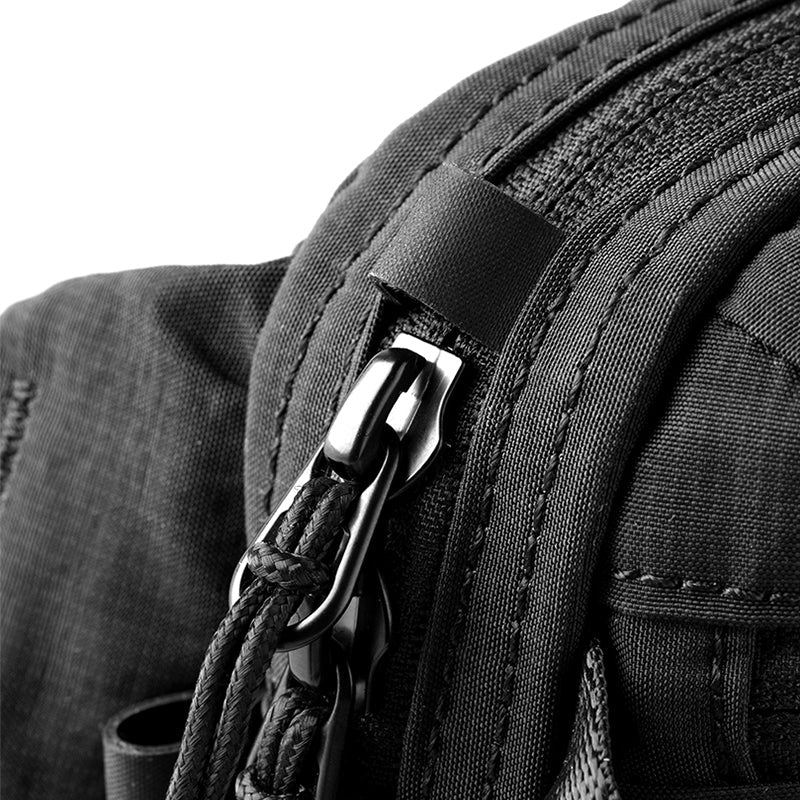 Close-up of black anti-theft crossbody bag's metal zipper with rope pull - MarkRyden Global
