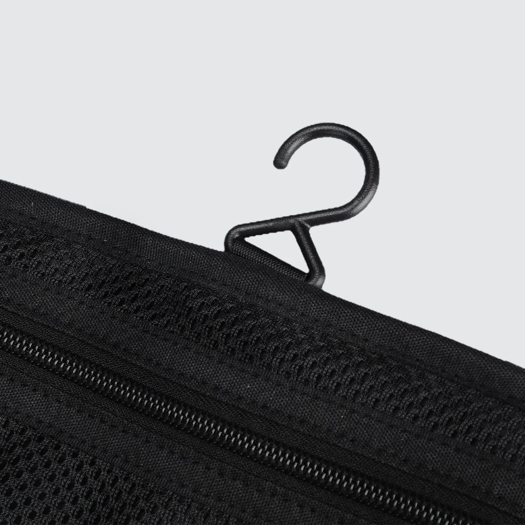 Black mesh wet-dry separate toiletry bag featuring MagiClip hook and zippers, designed for daily use.