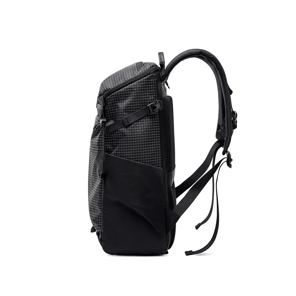 AeroPro 17.3" Laptop Backpack in black and gray checkered fabric with padded shoulder straps, large front pocket, and adjustable straps designed for travelers.