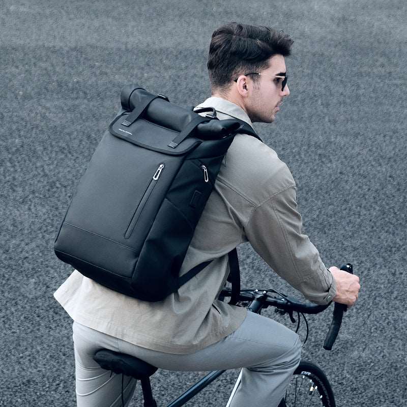 Black multifunctional 29L travel backpack on cyclist MARK RYDEN Global